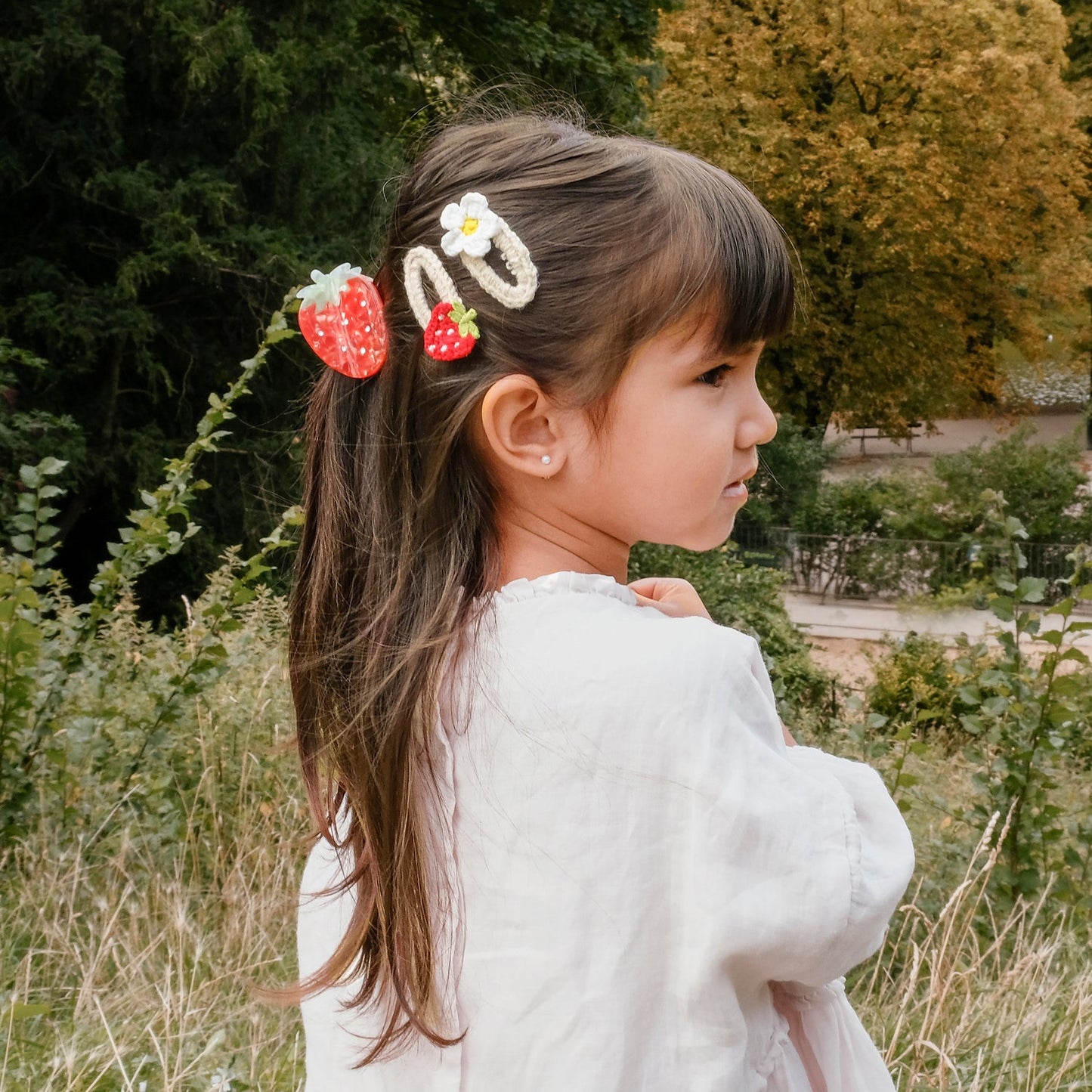 Crochet daisy and strawberry clips